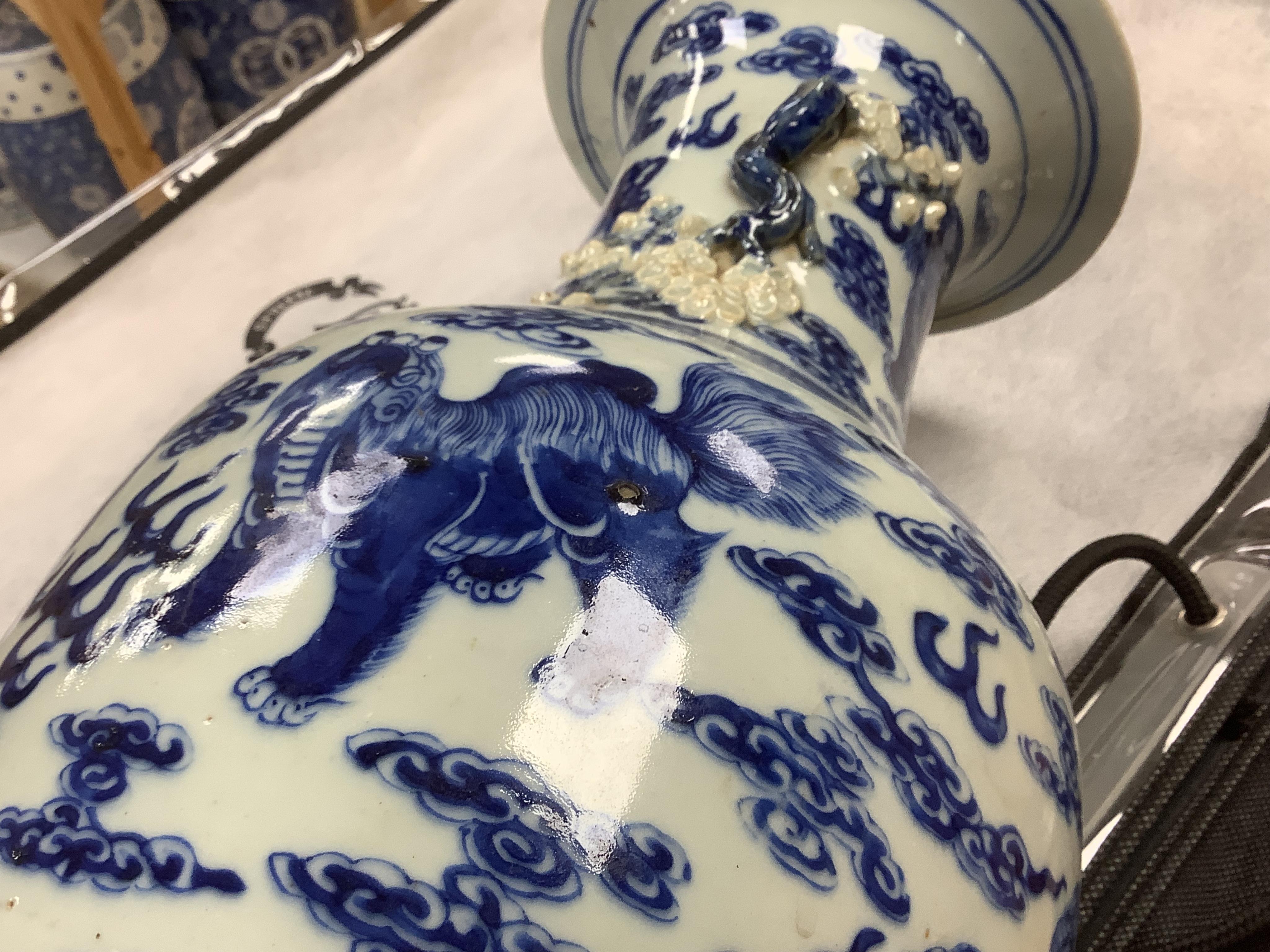 A Chinese baluster vase, painted with Buddhist lions in underglaze blue, 45cm high